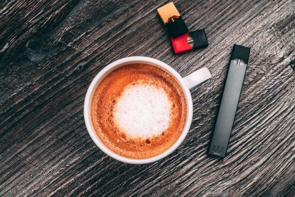 JUUL pod device on a table — pros and cons guide