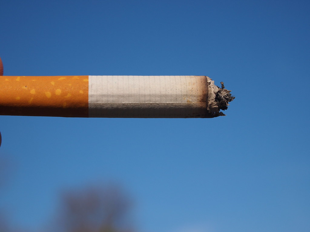 Close-up of a filtered cigarette — perfectly rolled cigarettes system