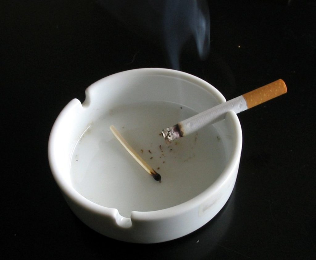 White ashtray with cigarette — best smokeless ashtrays guide