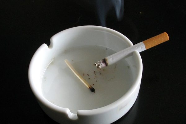 White ashtray with cigarette — best smokeless ashtrays guide