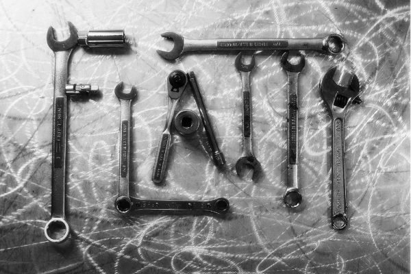 Wrenches laid out flat — how to fix a jammed cigarette rolling machine
