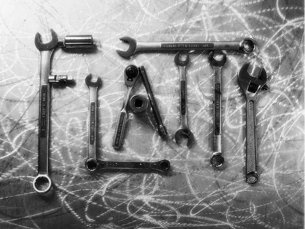 Wrenches laid out flat — how to fix a jammed cigarette rolling machine