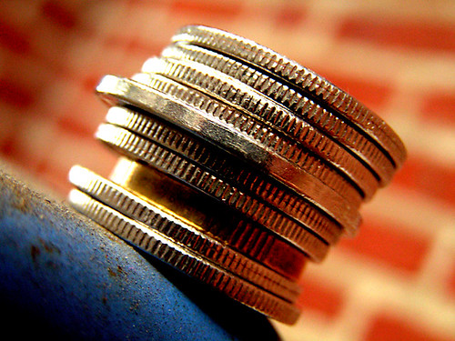 Stack of coins — are cigarette rolling machines worth it, the savings math