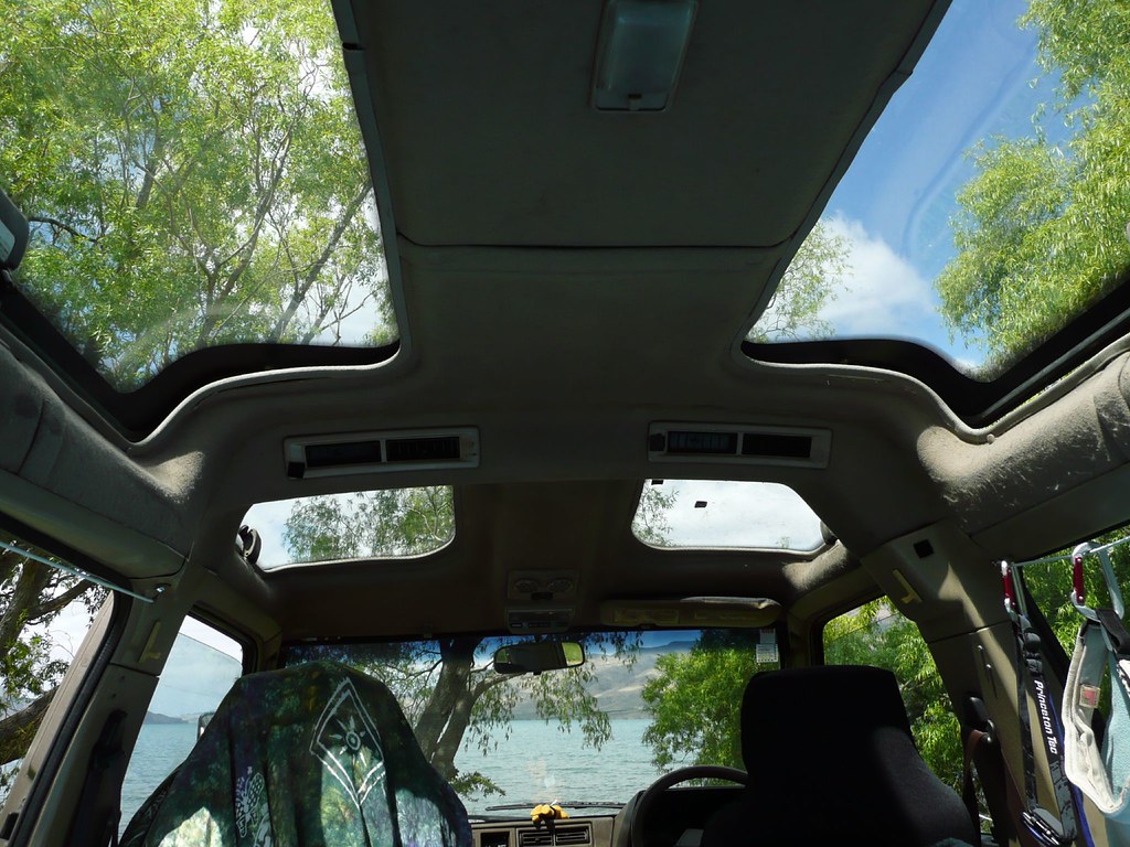 Open car sunroof letting in fresh air — how to get rid of cigarette smell