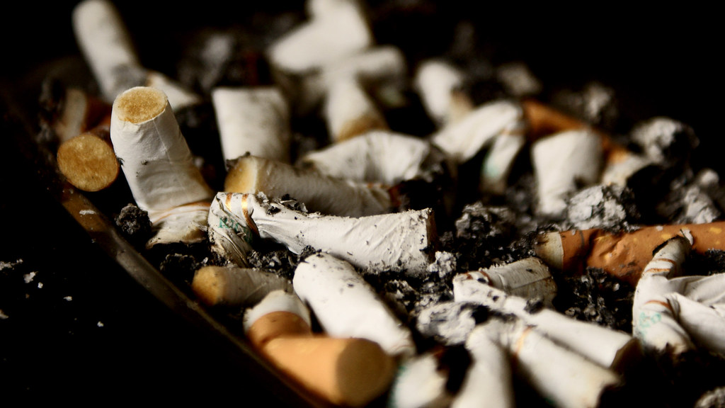 Stubbed-out cigarettes in an ashtray — how to quit smoking guide