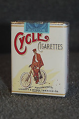 Vintage 1937 cigarette tin — the history of cigarette rolling machines